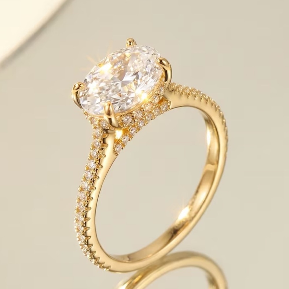 Golden Oval Solitaire Engagement Ring with Pavé Band